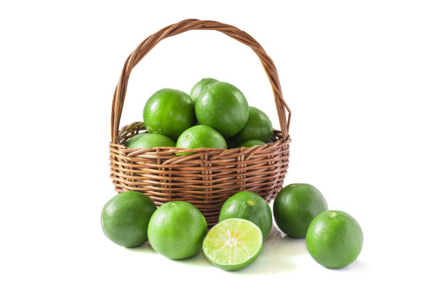 istock Green lemon in the basket isolated background 639986718