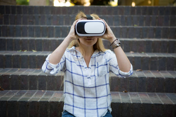 istock Woman enjoying her virtual world experience 639986768