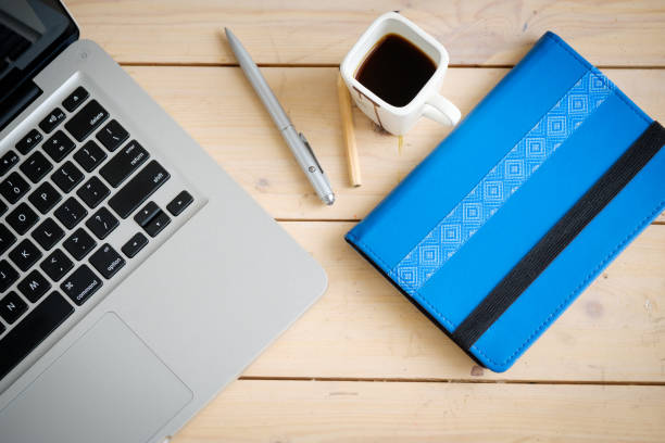 istock Wooden desk with various gadgets and accessories 639987592