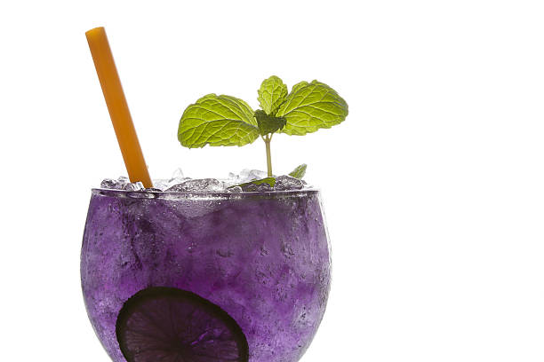 istock Close up Purple soda lime drink with lime on white 639987964