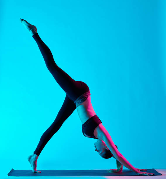 istock woman yoga exercises 639988058