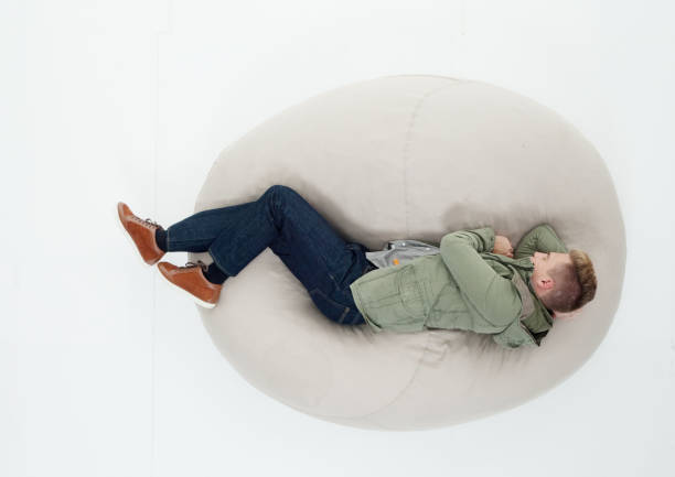 istock Above view of man sleeping on bean bag 639988300