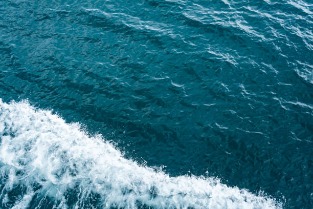 istock Blue sea and a moving reflection of sunlight 639989940