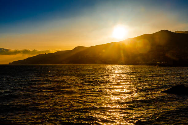 istock The sun sets behind the mountain 639990214
