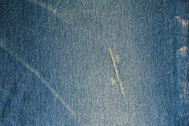 istock texture of Wrinkles and torn Jeans use for background 639994266