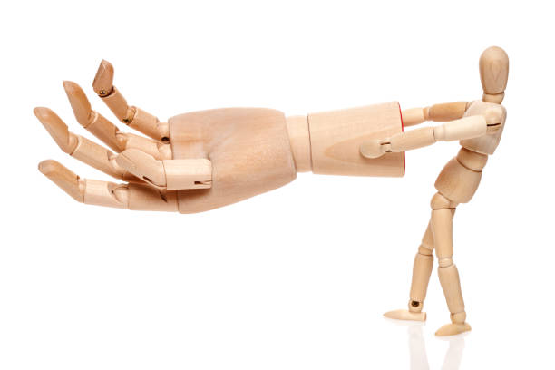 istock Wooden hand and  puppet 639994922