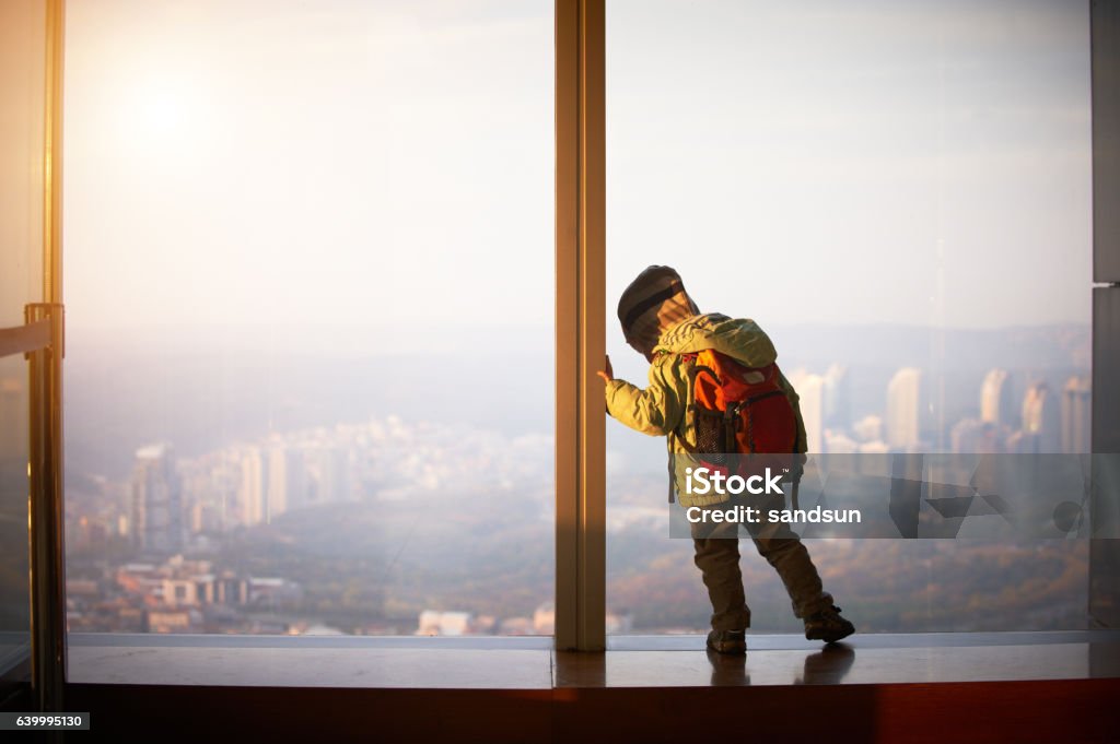 little boy walking on a observation deck Baby - Human Age Stock Photo