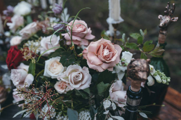 istock Wedding decorations. Bouquet of white and red flowers on a 639996370