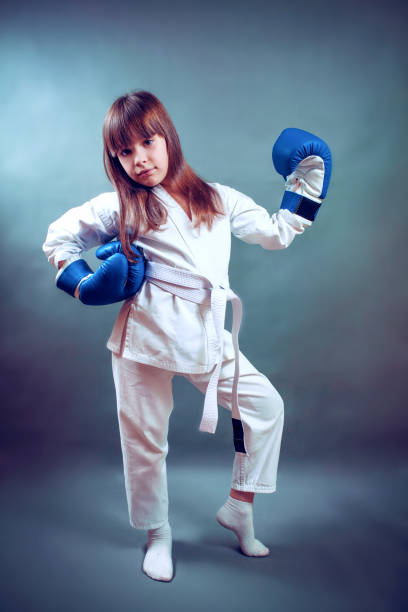 istock karate girl It fulfills kicks on  background 639997382