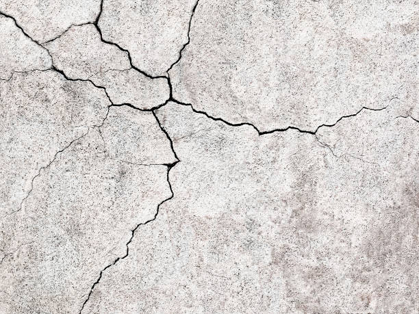texture gray wall damaged, cement background gray concrete wall with cracks texture as a background for design stone material stock illustrations