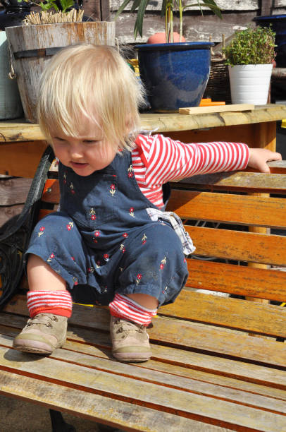 istock Little Girl on a Bench 640000018