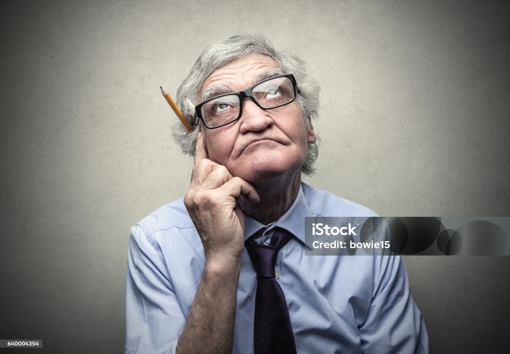 Senior businessman Portrait of an old businessman who is thinking about an idea Active Seniors Stock Photo