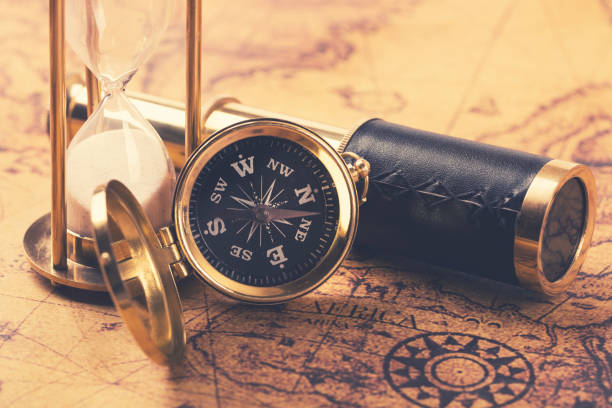 istock compass and nautical vintage equipment on old world map 640005150