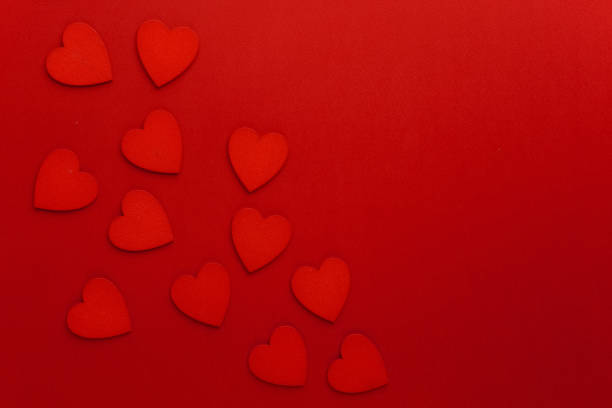 istock Decorative hearts are on red paper. Flat lay. 640005368