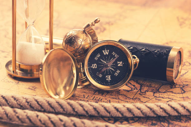 istock vintage compass and nautical items on ancient world map 640006048
