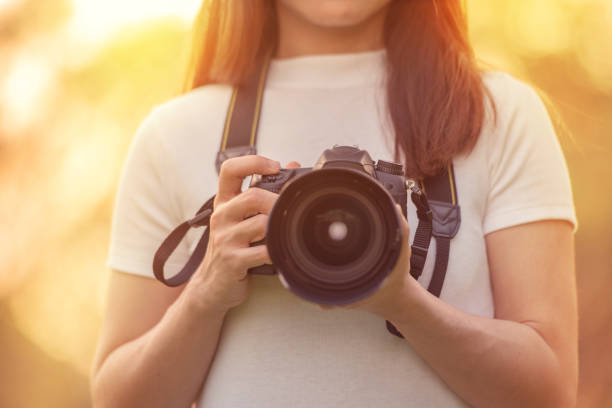 istock Woman with dslr camera 640007506