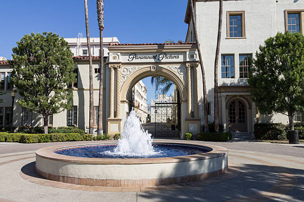 Paramount Pictures Los Angeles, United States - September 18, 2016: The famous adorned entrance arch with a fountain of Paramount Pictures, Hollywood, Los Angeles, California. paramount studios stock pictures, royalty-free photos & images