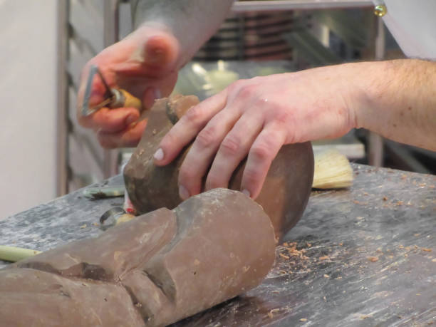 istock Hands cut out a sculpture from a chocolate 640012784