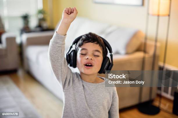 Child Rocking Out To Music Stock Photo - Download Image Now - Child, Singing, Music