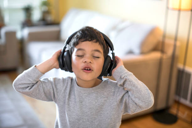 istock Child Rocking Out to Music 640014320