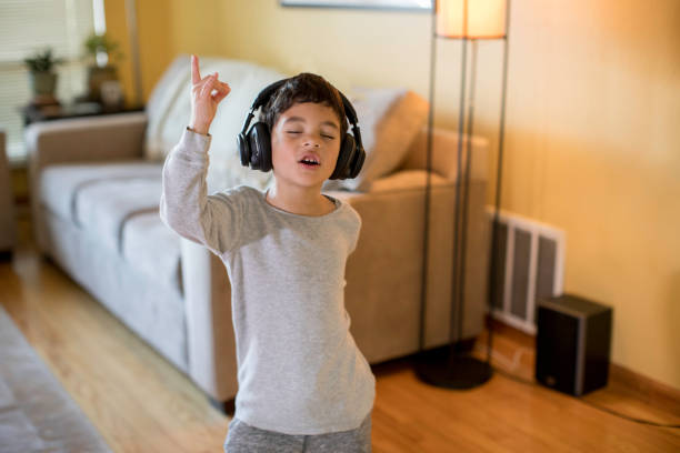 istock Child Rocking Out to Music 640014430