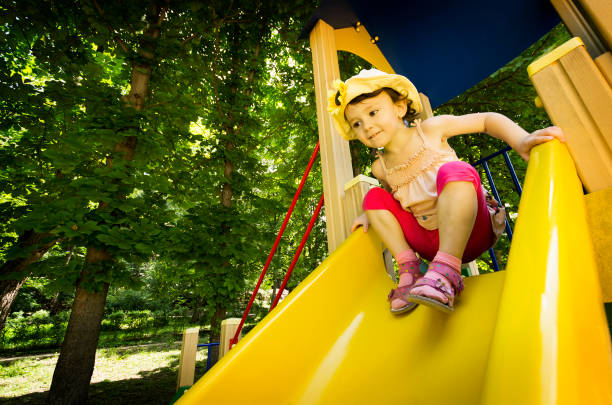 istock Little girl playing on playground 640014498