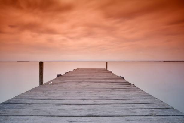 istock wooden pier at sunset 640017044