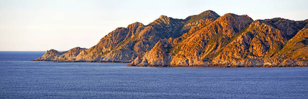 Agriates coastline in northern Corsica Agriates coastline in northern Corsica at Punta di Paraghiola in sunset light.   Haute-Corse, France haute corse photos stock pictures, royalty-free photos & images