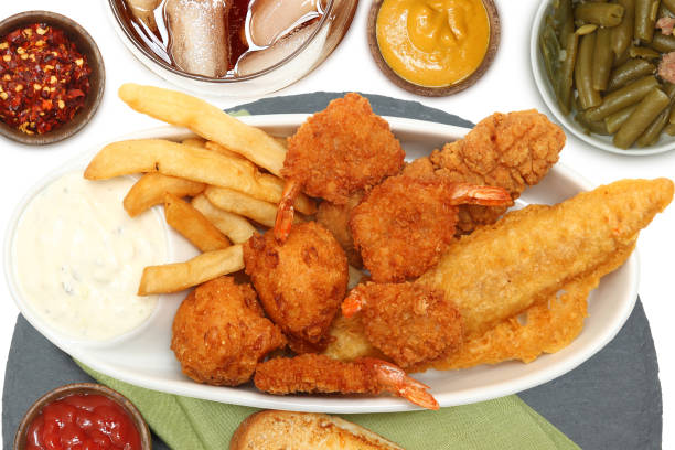 Southern Fried Fish and Chicken with garlic bread, tarter sauce, fries, hushpuppies and shrimp.