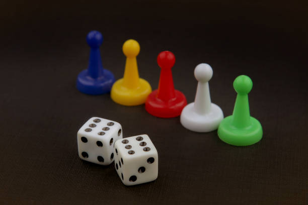 istock Colorful play figures and dices with double six. 640022024