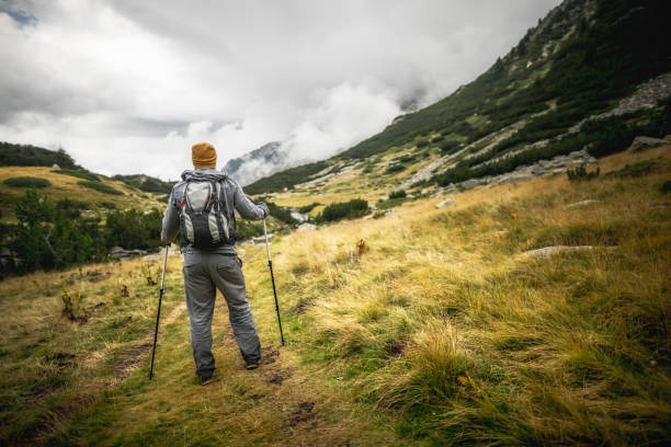 istock Traveler walking alone in the mountains 640023668