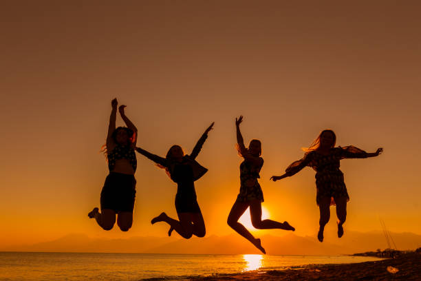 istock Group of friends jumping on the beach 640023758