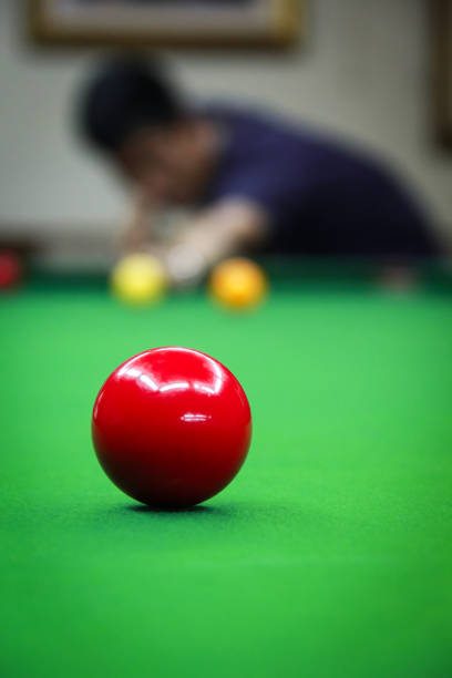 istock Red Ball Backgrouded with Man Playing Snooker 640024686