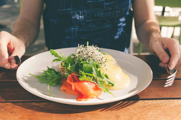 istock Healthy brunch - poached egg with smoked slmon and salad 640025722