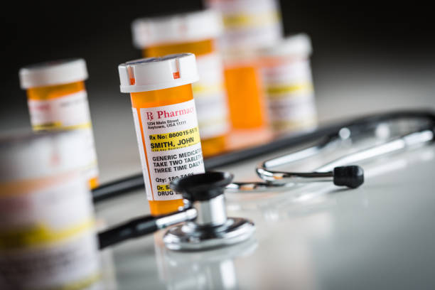 istock Nonproprietary Medicine Prescription Bottles Abstract with Stet 640025852