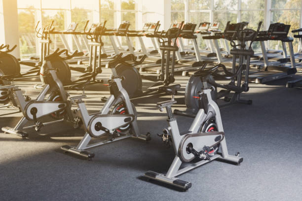 istock Modern gym interior with equipment, fitness exercise bikes 640025902