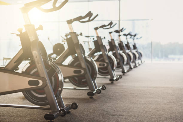istock Modern gym interior with equipment, fitness exercise bikes 640026080