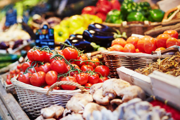 Fresh healthy bio fruits and vegetables on market Fresh healthy bio fruits and vegetables on farmer agricultural market in France vegetable stand stock pictures, royalty-free photos & images