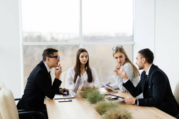istock Corporate work. Team  working in conference room  in modern office. 640029102