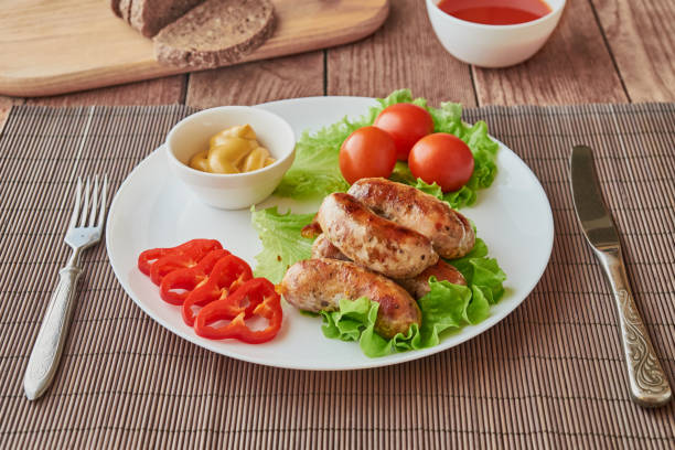 istock Grilled sausages with beer on a wooden background 640031476