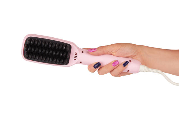 istock Hair straighteners in hand 640034788