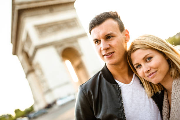 istock lovely couple loving at sunset at arch du triomphe 640035876