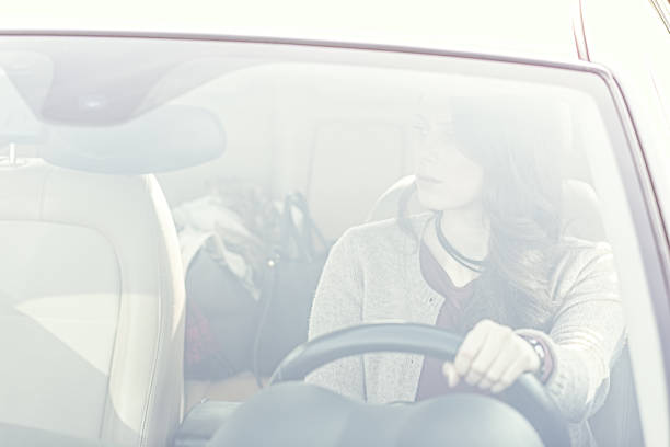 istock Beautiful young girl driving car 640039534