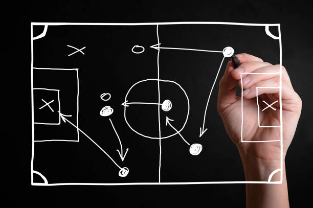Strategy Hand drawing a football strategy plan drawn on a virtual screen defending sport photos stock pictures, royalty-free photos & images