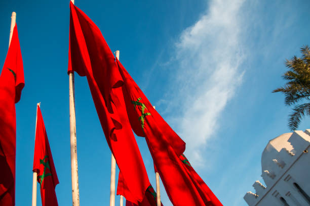 istock Moroccan flags in Marrakech on a background of blue sky 640039860