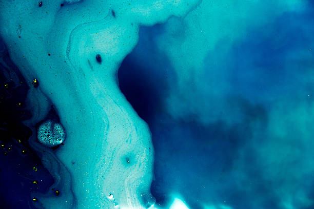 istock abstract background of blue colored foam and bubbles on water 640040180
