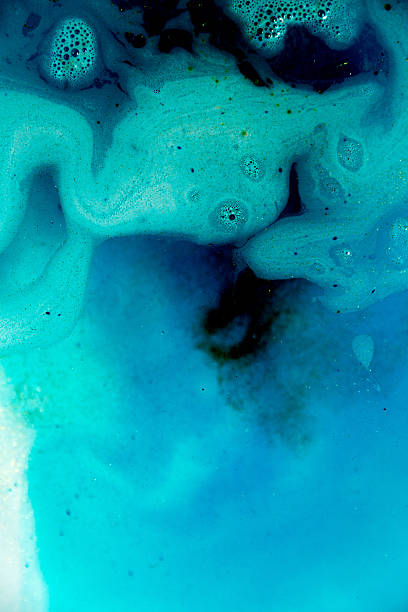 istock abstract background of blue colored foam and bubbles on water 640041652