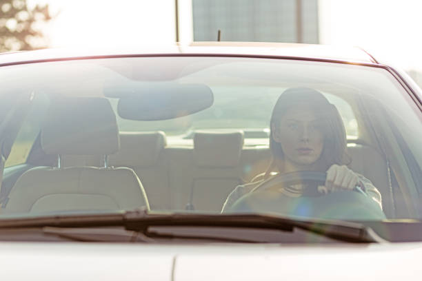 istock Beautiful young girl driving car 640041668