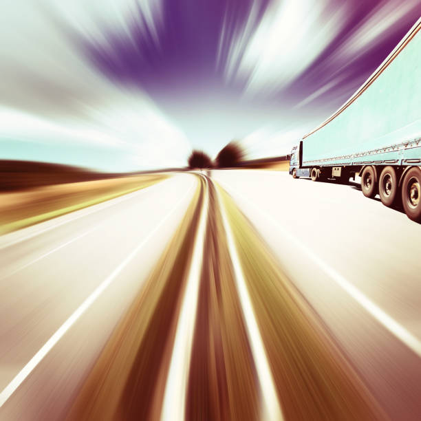 istock Blue truck on Highway throurg the summer fields 640042356