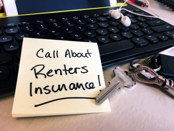 Note on desk keyboard to call about renters insurance Note on desktop computer keyboard to call insurance and learn about renter tenant insurance policy when renting apartment tenant stock pictures, royalty-free photos & images